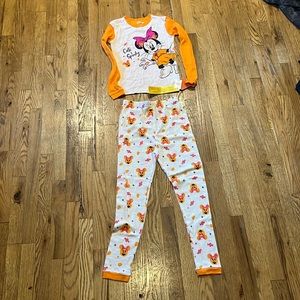 I'm selling a spooky Minnie pj set it's black pink and orange the size is 12